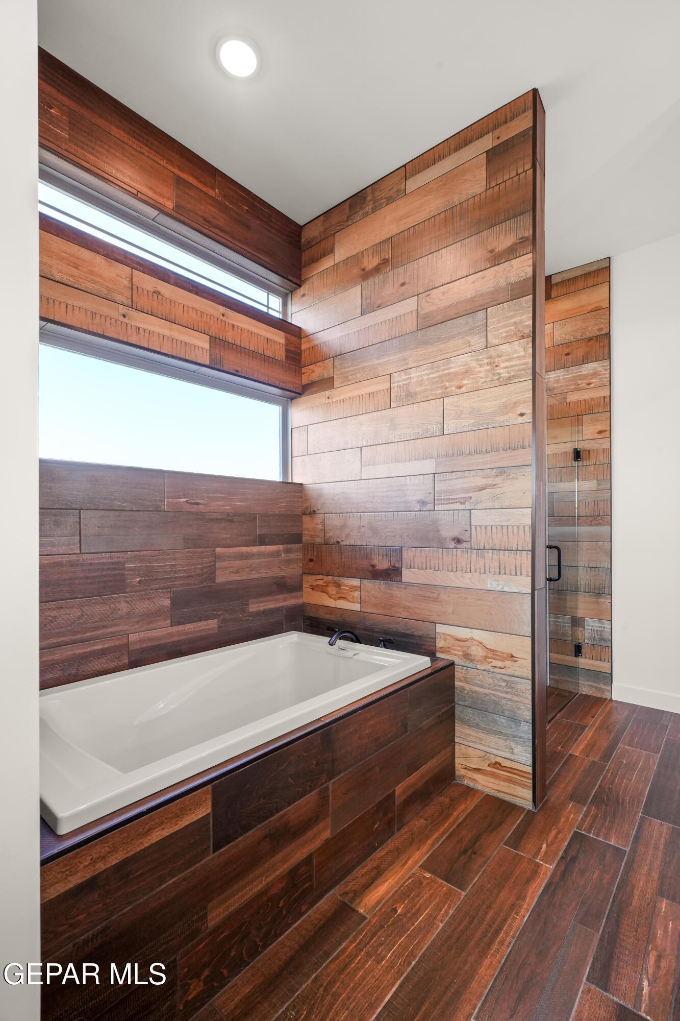 5953 Ruidoso Downs Street El Paso, TX 79932 - Photo 34 of 56 a view of washer and dryer with wooden floor