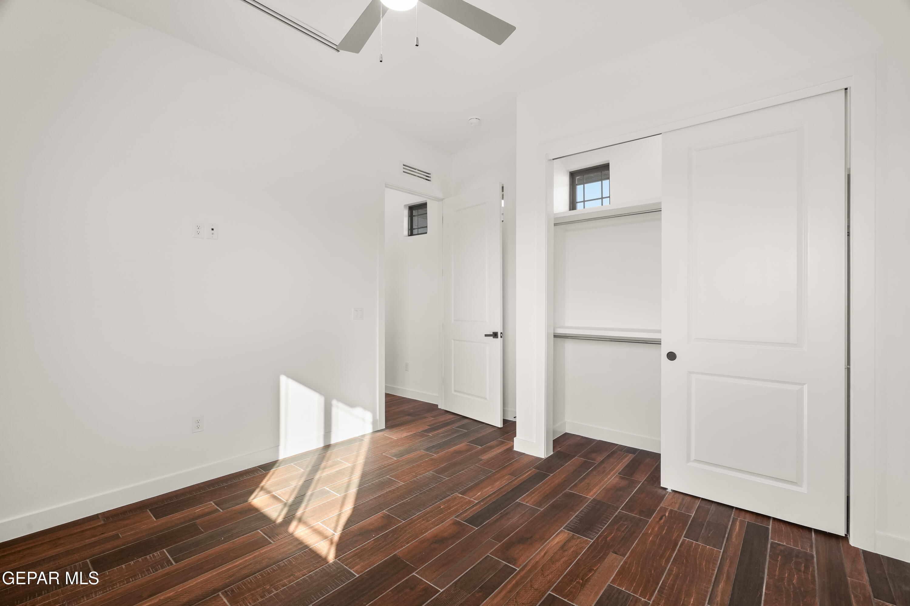 5953 Ruidoso Downs Street El Paso, TX 79932 - Photo 41 of 56 a view of empty room with wooden floor