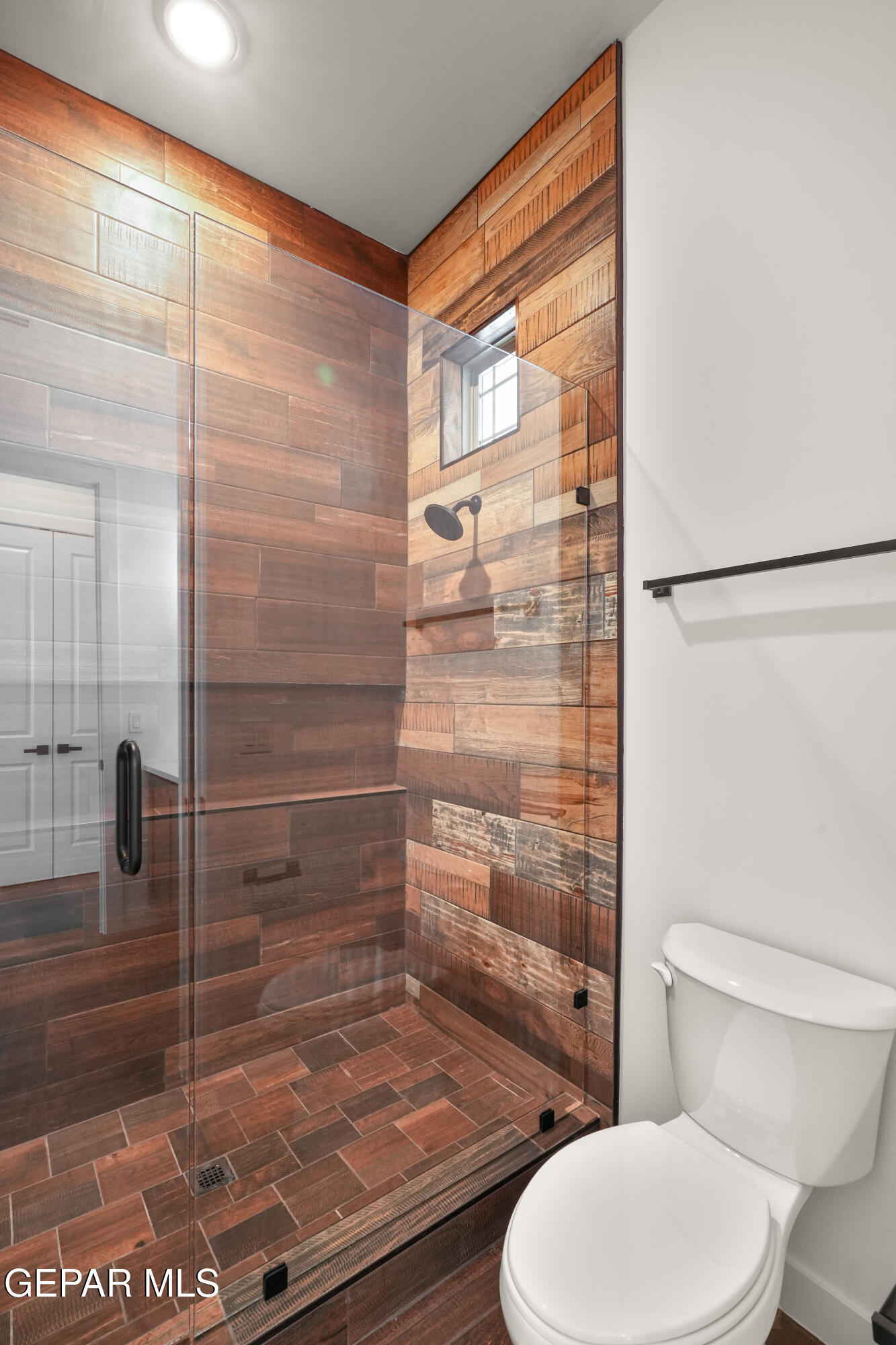 5953 Ruidoso Downs Street El Paso, TX 79932 - Photo 43 of 56 a bathroom with a toilet and a shower