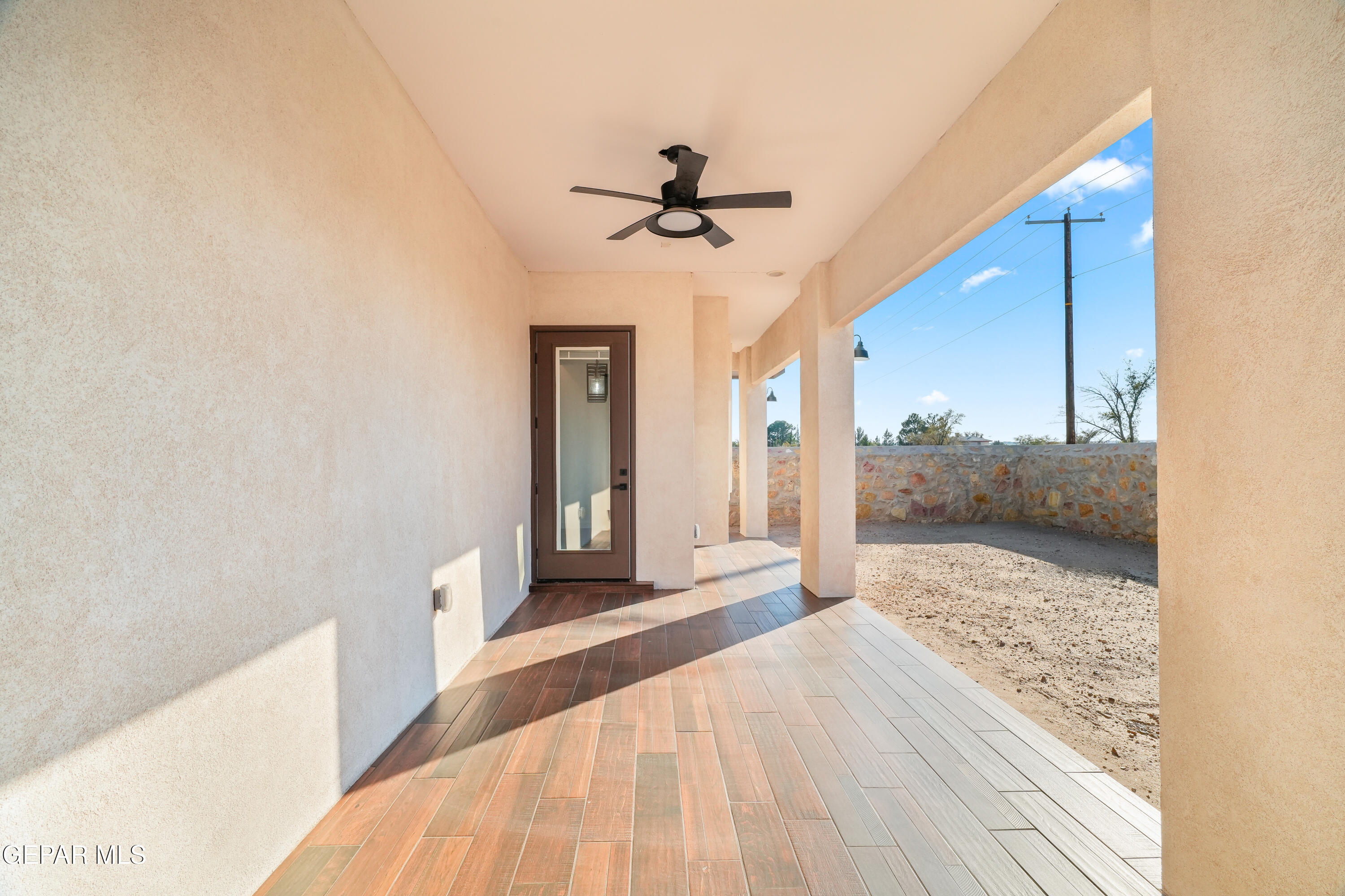 5953 Ruidoso Downs Street El Paso, TX 79932 - Photo 48 of 56 a view of a hallway to a house and wooden floor