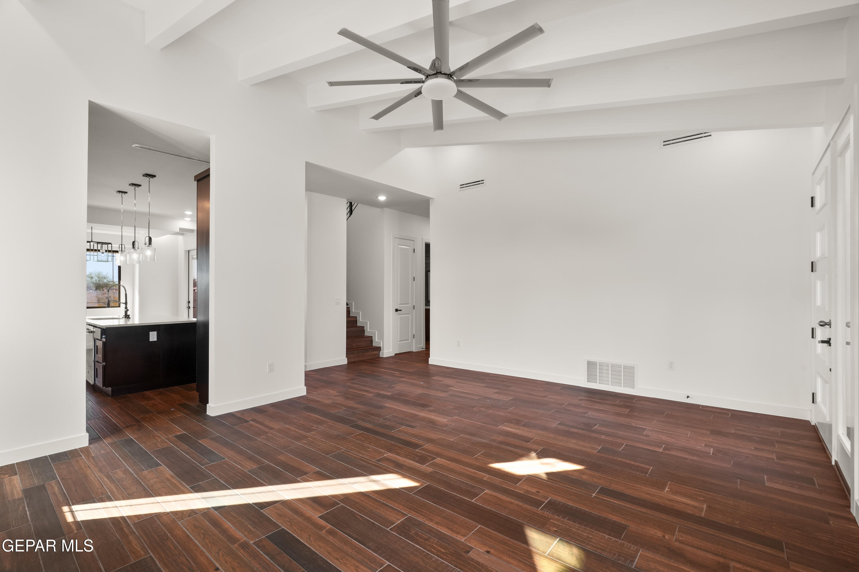5953 Ruidoso Downs Street El Paso, TX 79932 - Photo 8 of 56 a view of an empty room with window and wooden floor