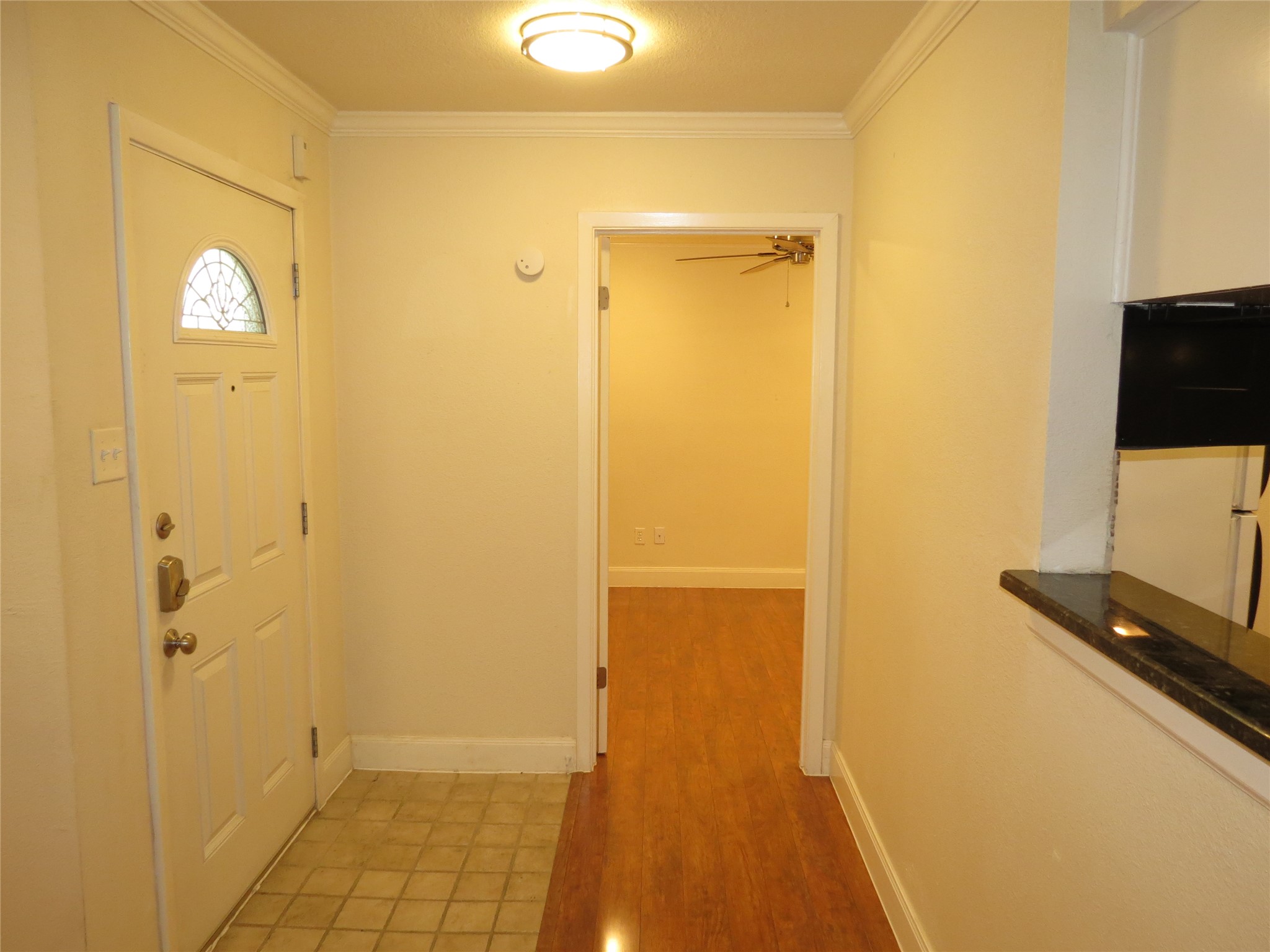 4159 Steck Avenue, Unit 269 Austin, TX 78759 - Photo 4 of 21 A welcoming entryway with warm wood and tile floors, connecting to bright living spaces.