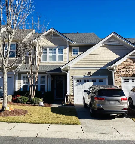 a view of a livingroom with entryway and stairs