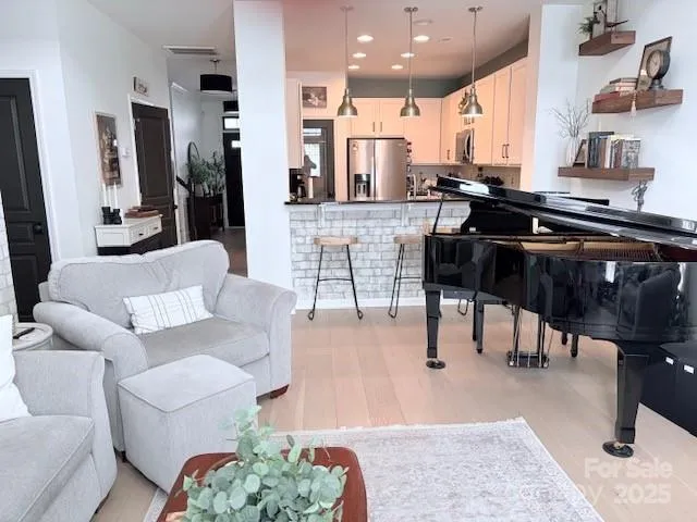 a living room with furniture and a rug