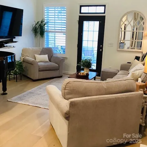 a bedroom with a bed and a night stand