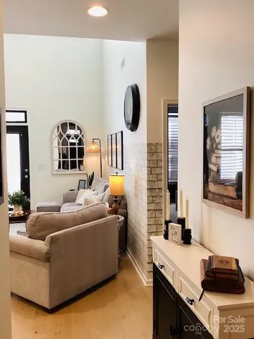 a bedroom with a bed and painting on the wall