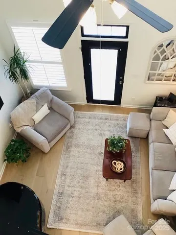 a bedroom with a bed and a wall painting