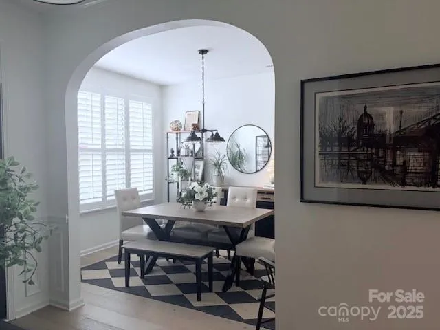 a kitchen with granite countertop a stove a sink and a microwave
