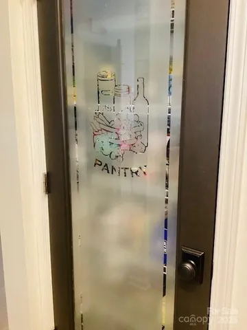 a living room with furniture and a flat screen tv with wooden floor