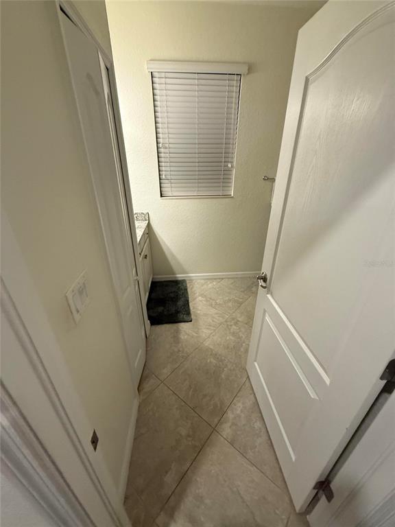 17006 Blue Ridge Place Bradenton, FL 34211 - Photo 13 of 38 a bathroom with a tub shower and a sink