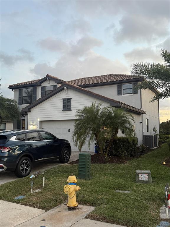17006 Blue Ridge Place Bradenton, FL 34211 - Photo 2 of 38 a view of a car parked front of a house