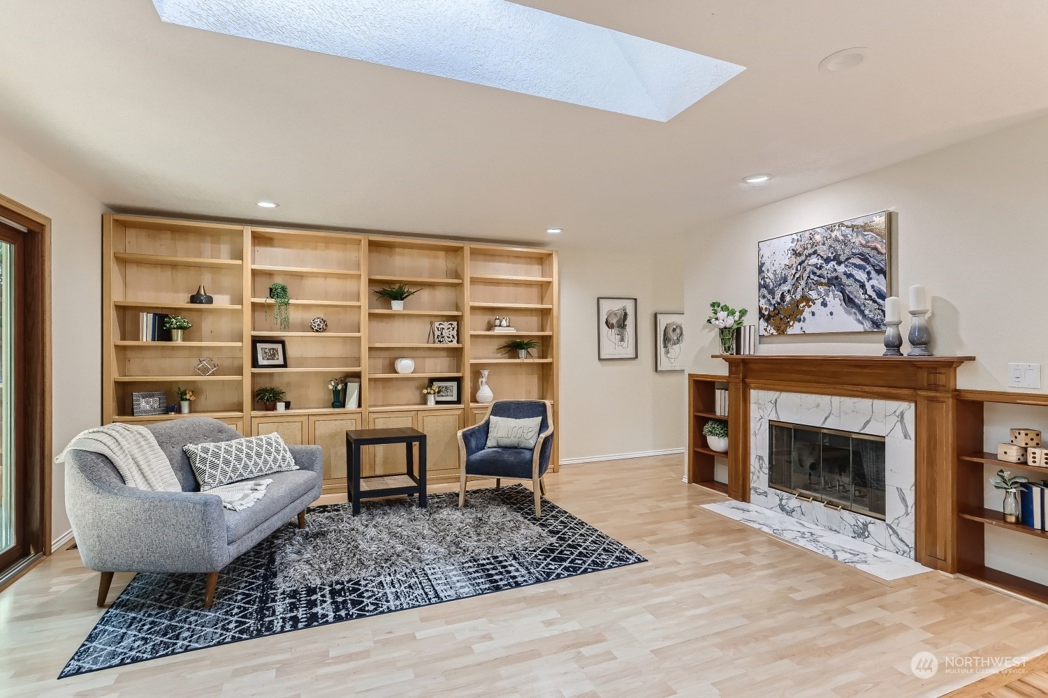 2626 242nd Place Southeast Bothell, WA 98021 - Photo 13 of 26 a living room with furniture and a fireplace