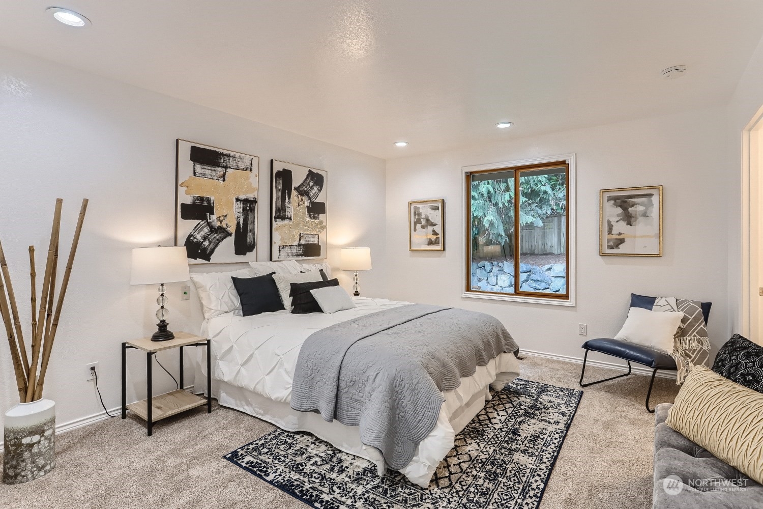 2626 242nd Place Southeast Bothell, WA 98021 - Photo 14 of 26 a bedroom with a bed and a couch