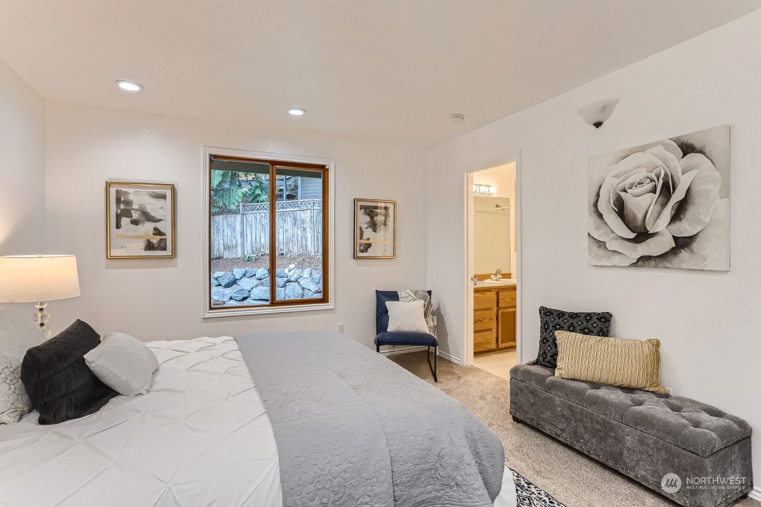 2626 242nd Place Southeast Bothell, WA 98021 - Photo 15 of 26 a bedroom with a bed and a couch