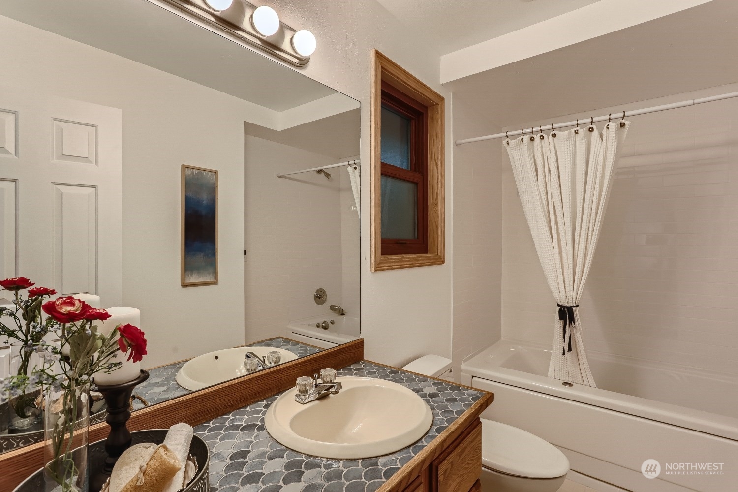 2626 242nd Place Southeast Bothell, WA 98021 - Photo 17 of 26 a bathroom with a sink mirror vanity and toilet