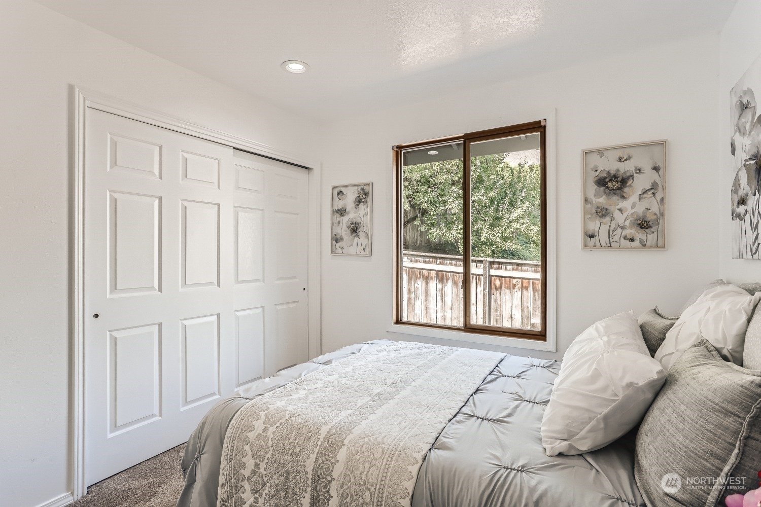 2626 242nd Place Southeast Bothell, WA 98021 - Photo 20 of 26 a bed sitting in a bedroom next to a window