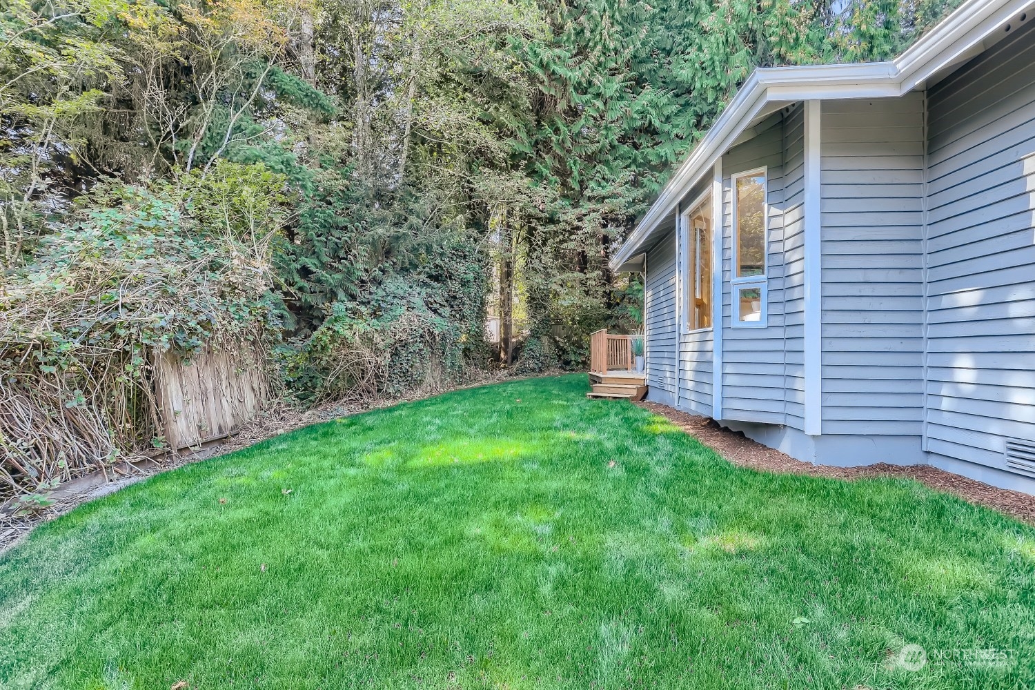 2626 242nd Place Southeast Bothell, WA 98021 - Photo 25 of 26 a view of a backyard with barn and large trees