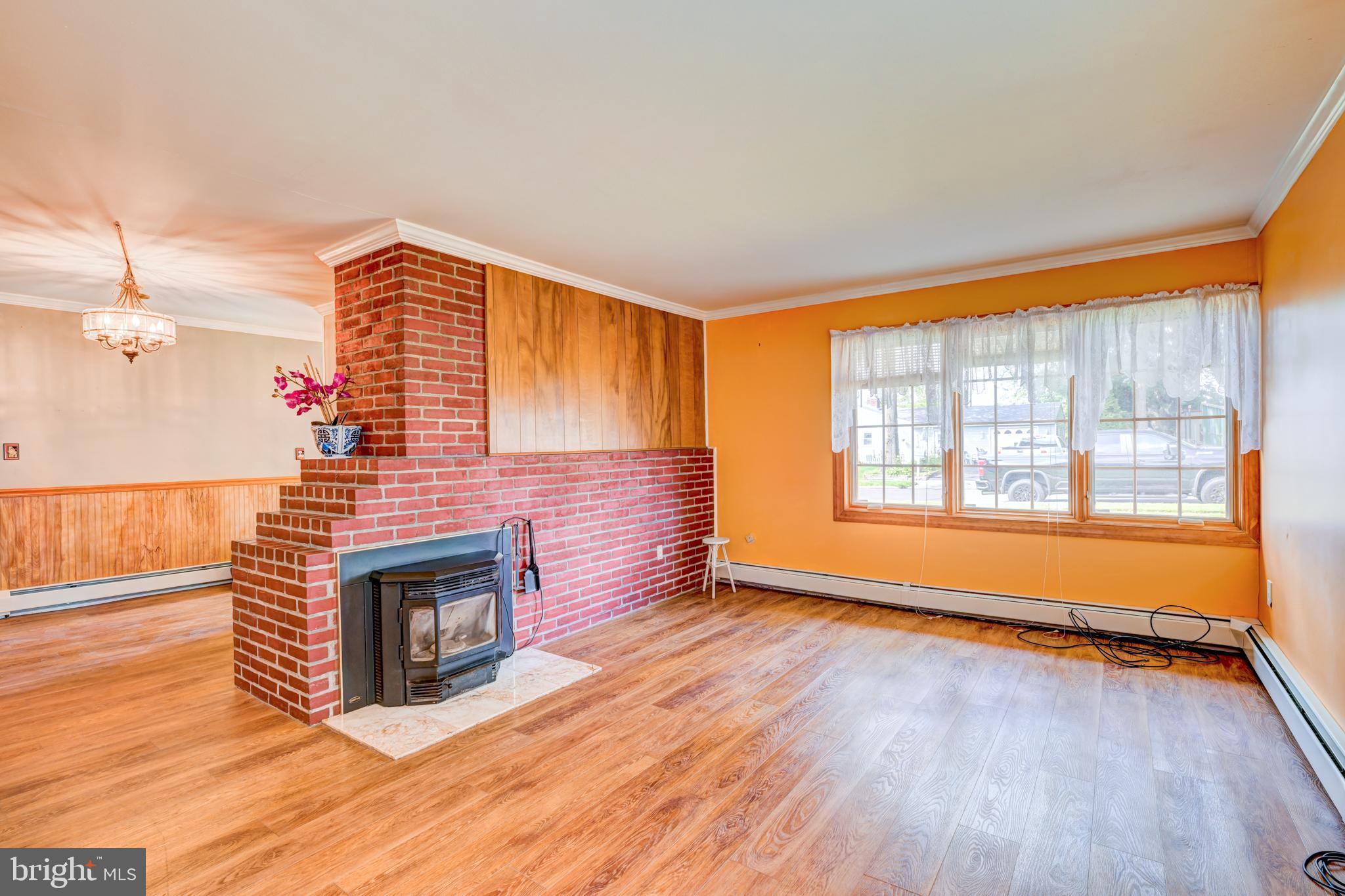 32 Gaping Rock Road Levittown, PA 19057 - Photo 4 of 28 a view of an empty room with wooden floor and a window