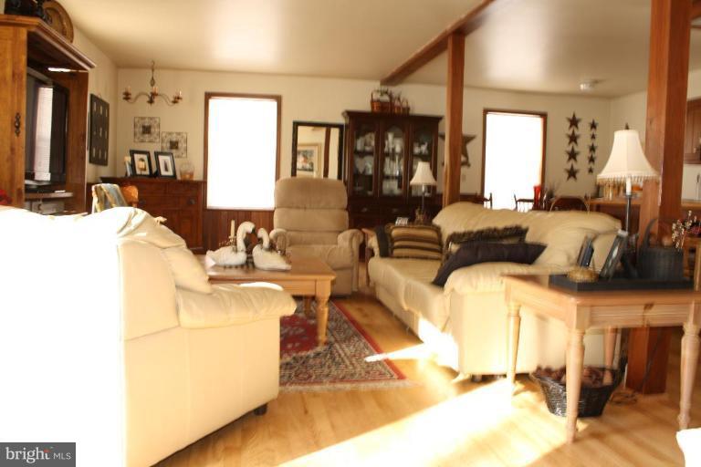 101 Carriage Court High View, WV 26808 - Photo 13 of 22 a living room with fireplace furniture and a wooden floor