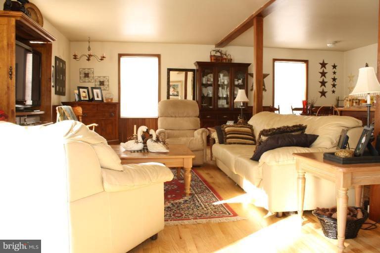 101 Carriage Court High View, WV 26808 - Photo 14 of 22 a living room with furniture and a lamp