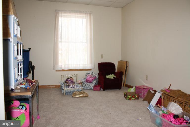 101 Carriage Court High View, WV 26808 - Photo 17 of 22 a bedroom with furniture and a window