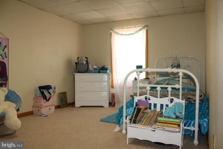 101 Carriage Court High View, WV 26808 - Photo 18 of 22 a bedroom with bed and a window