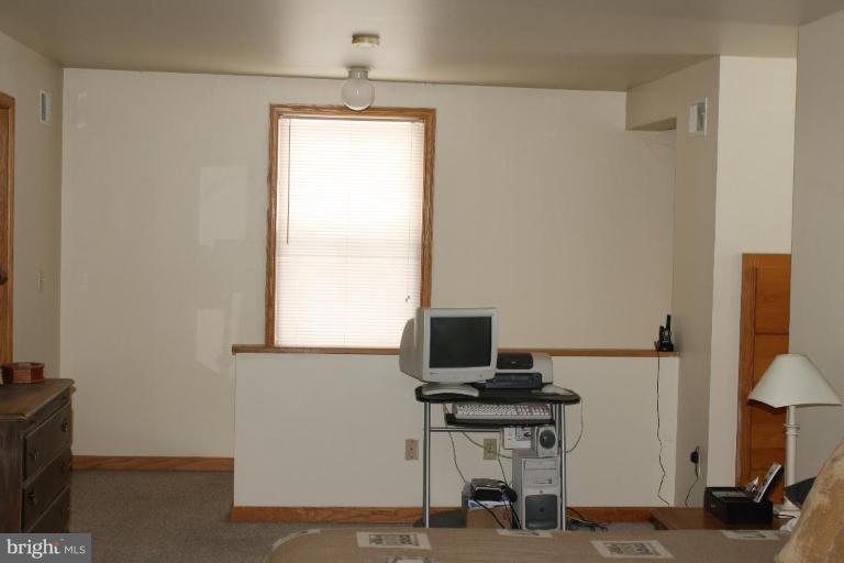 101 Carriage Court High View, WV 26808 - Photo 5 of 22 a view of a workspace with furniture and a window