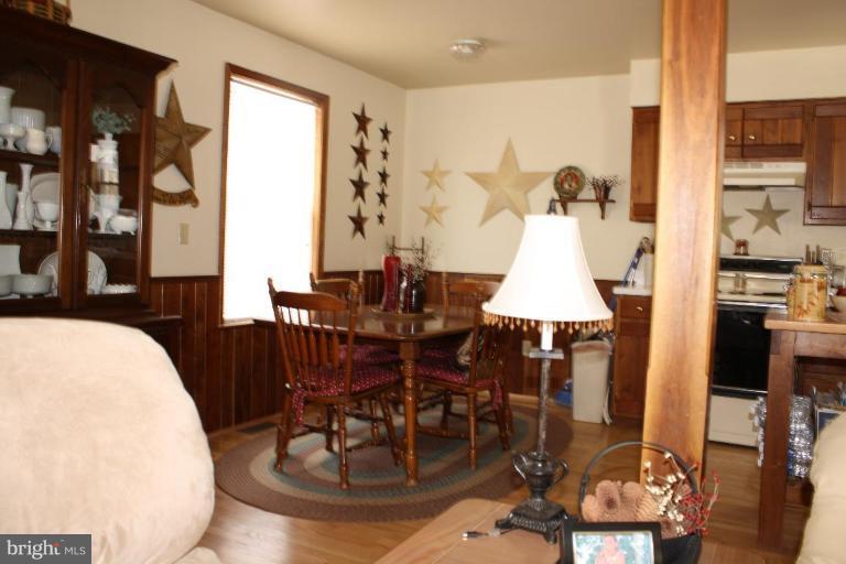 101 Carriage Court High View, WV 26808 - Photo 7 of 22 a dining room with furniture window and wooden floor