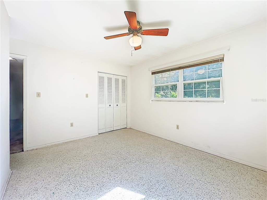 7802 Mizell Street Coleman, FL 34785 - Photo 22 of 44 an empty room with a window