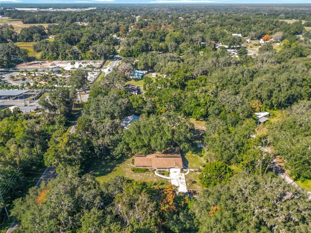 7802 Mizell Street Coleman, FL 34785 - Photo 37 of 44 an aerial view of residential house with space and trees all around