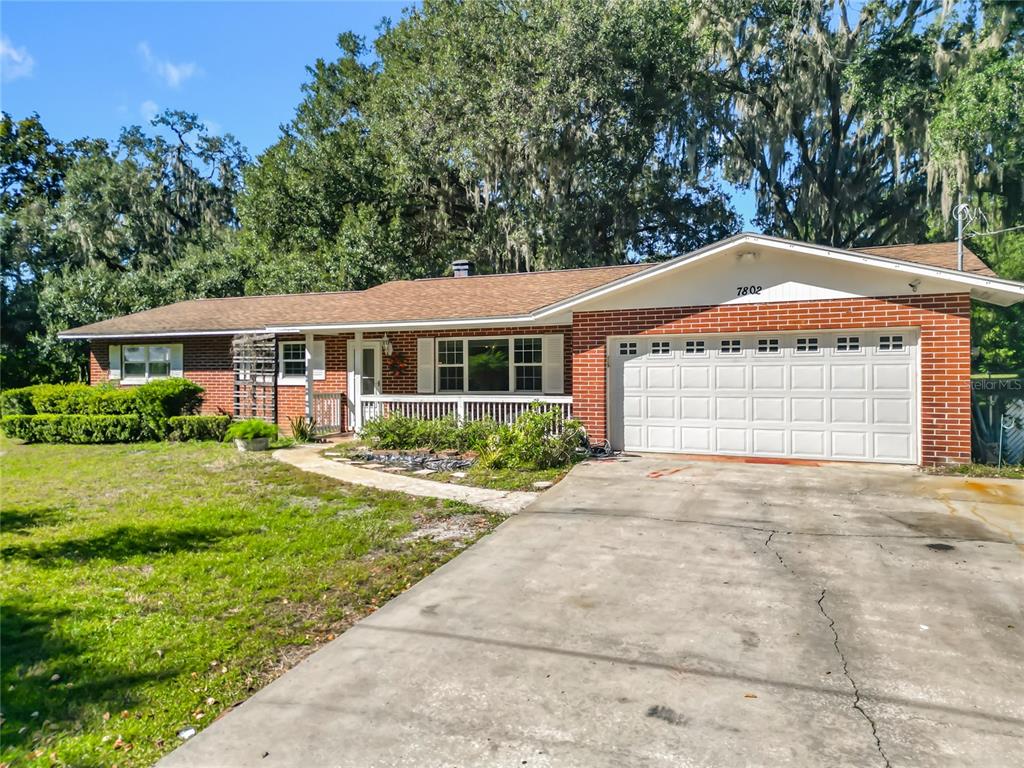 7802 Mizell Street Coleman, FL 34785 - Photo 39 of 44 a front view of a house with a yard