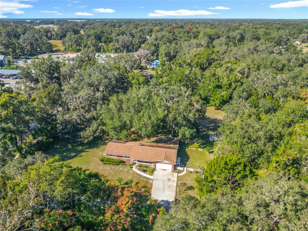7802 Mizell Street Coleman, FL 34785 - Photo 41 of 44 an aerial view of a house with a yard