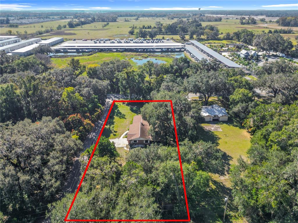 7802 Mizell Street Coleman, FL 34785 - Photo 42 of 44 an aerial view of residential houses with outdoor space and swimming pool