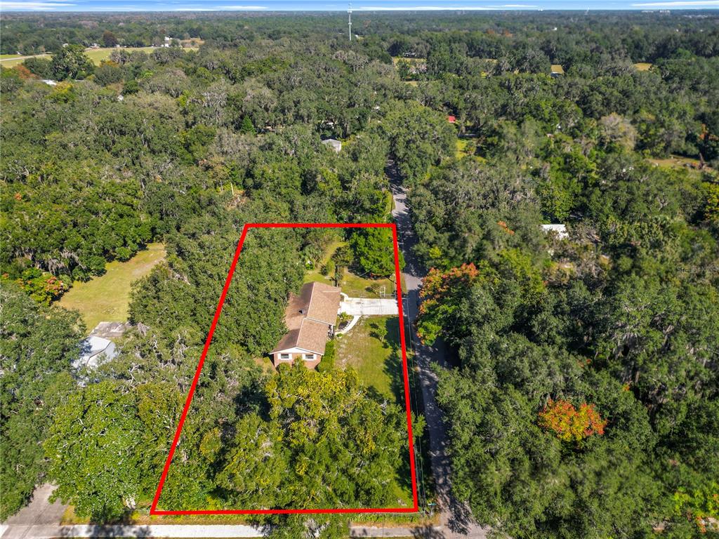 7802 Mizell Street Coleman, FL 34785 - Photo 43 of 44 an aerial view of a residential houses with yard and swimming pool