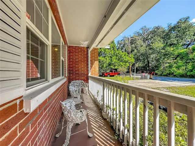 a view of balcony with furniture