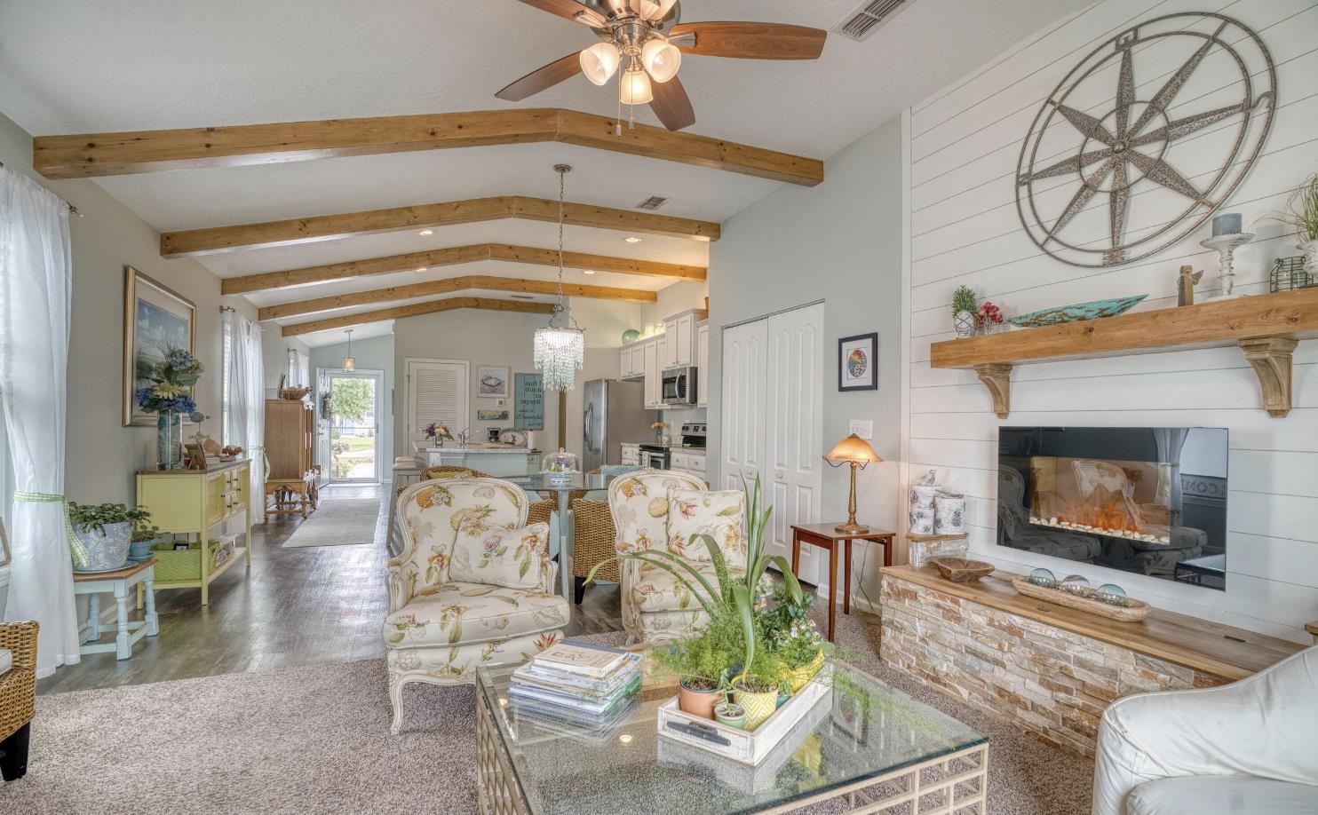 583 Ashby Landing Way St. Augustine, FL 32086 - Photo 1 of 1 a living room with furniture a fireplace and a chandelier