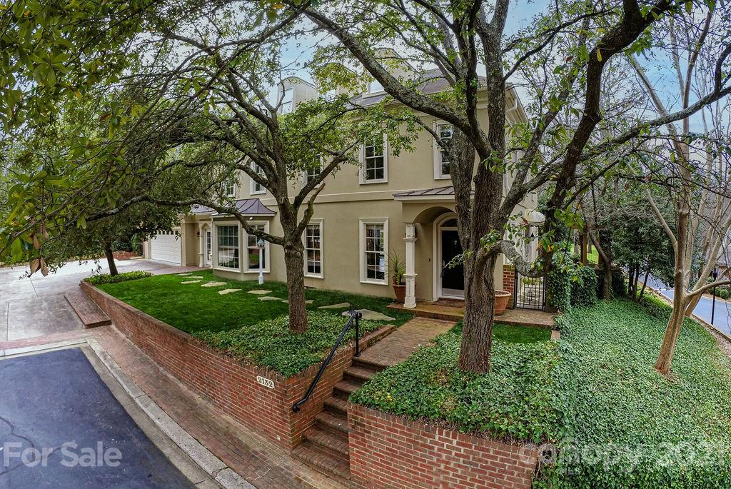 2132 Rolston Drive Charlotte, NC 28207 - Photo 2 of 48 a front view of a house with garden