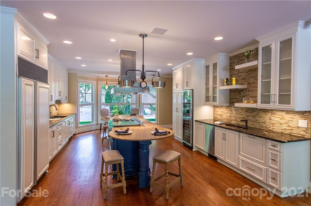 2132 Rolston Drive Charlotte, NC 28207 - Photo 11 of 48 a kitchen with granite countertop lots of counter top space and stainless steel appliances