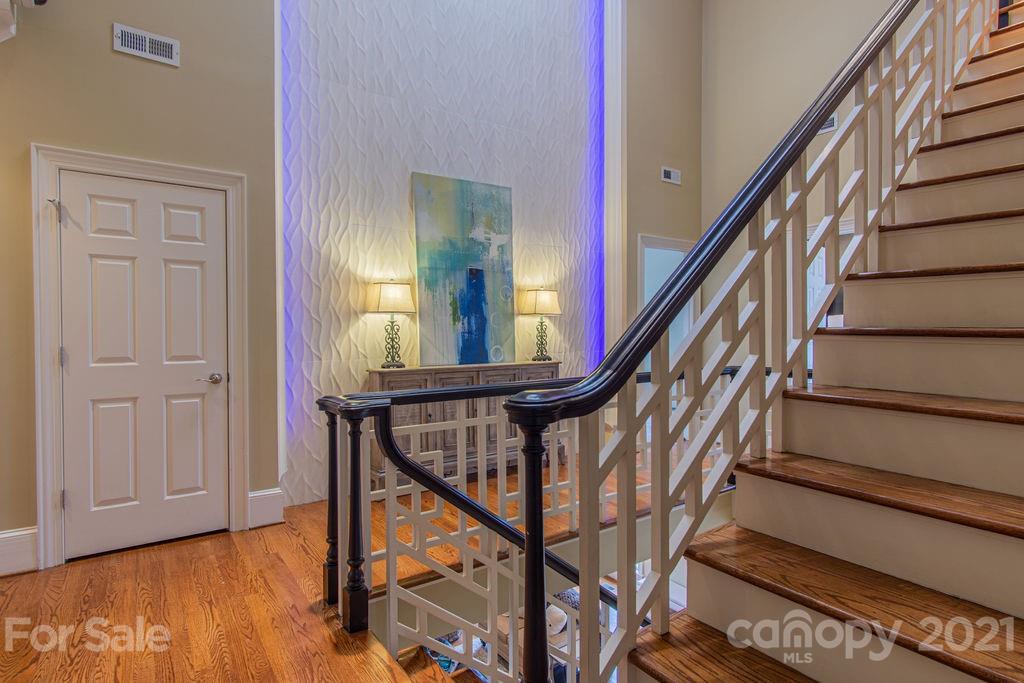 2132 Rolston Drive Charlotte, NC 28207 - Photo 26 of 48 a view of an entryway with wooden floor and stairs
