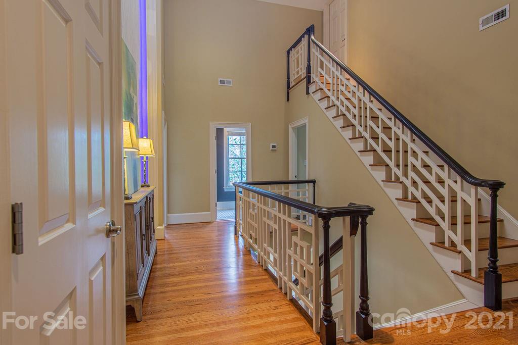 2132 Rolston Drive Charlotte, NC 28207 - Photo 27 of 48 a view of staircase with wooden floor and stairs
