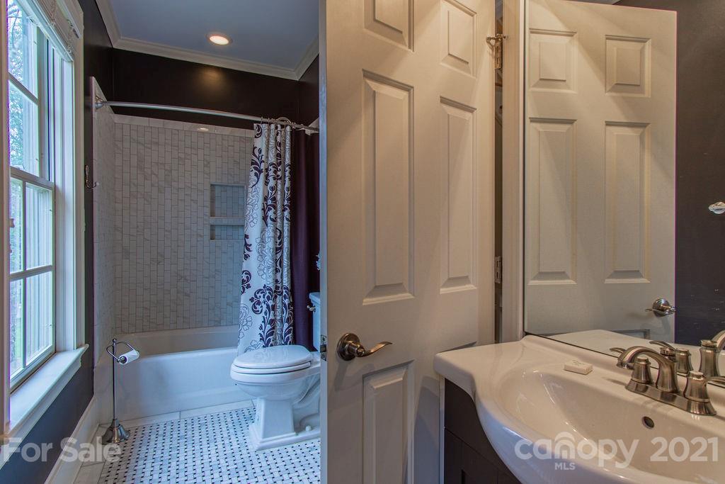 2132 Rolston Drive Charlotte, NC 28207 - Photo 28 of 48 a bathroom with a sink toilet and shower