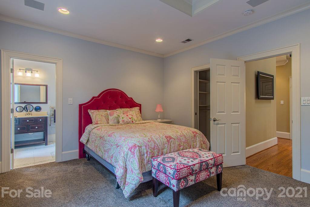 2132 Rolston Drive Charlotte, NC 28207 - Photo 31 of 48 a bedroom with a bed and a dresser