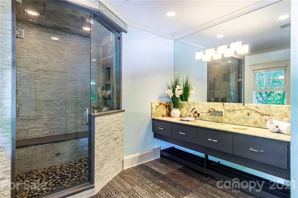 2132 Rolston Drive Charlotte, NC 28207 - Photo 34 of 48 a bathroom with a double vanity sink and a mirror