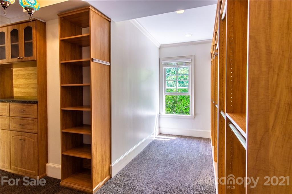 2132 Rolston Drive Charlotte, NC 28207 - Photo 40 of 48 a view of an empty room with cabinet and a window