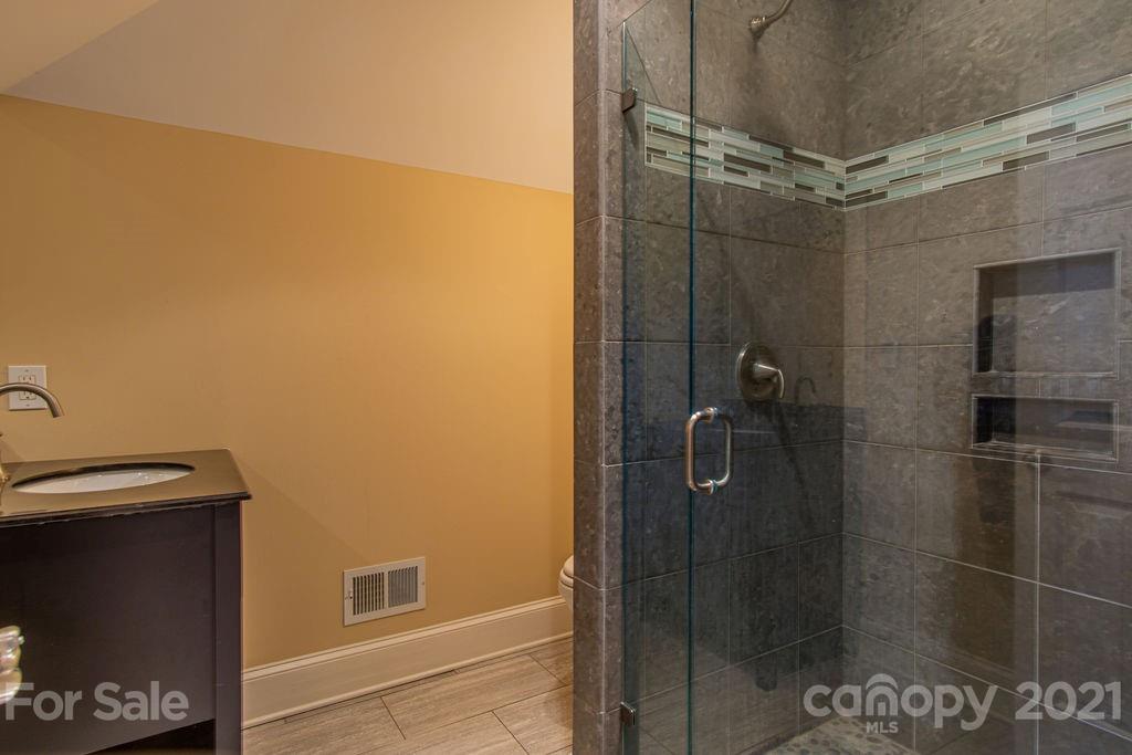 2132 Rolston Drive Charlotte, NC 28207 - Photo 42 of 48 a bathroom with a shower