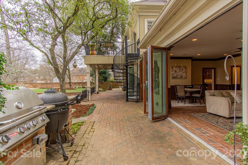 2132 Rolston Drive Charlotte, NC 28207 - Photo 46 of 48 a view of a porch with furniture and a yard