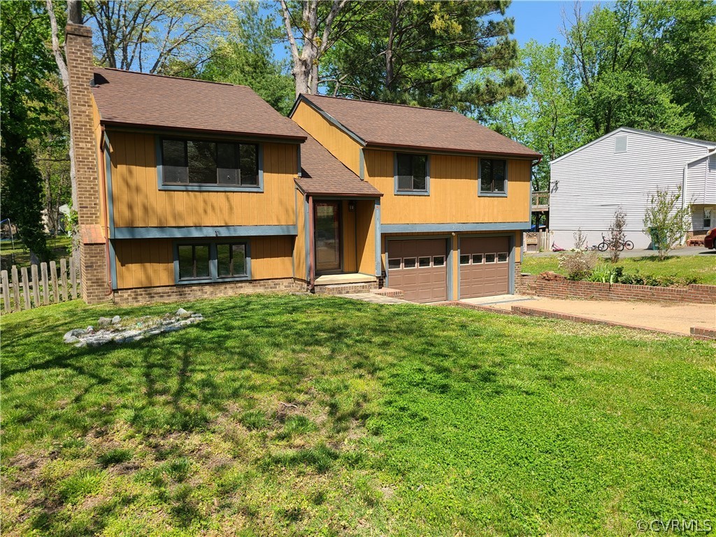9326 Emmett Road Glen Allen, VA 23060 - Photo 1 of 29 a view of a house with a yard patio and a garden