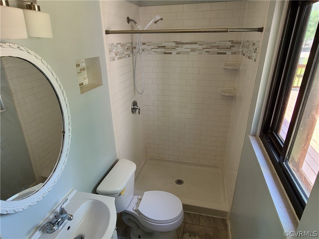 9326 Emmett Road Glen Allen, VA 23060 - Photo 12 of 29 a bathroom with a shower and a toilet