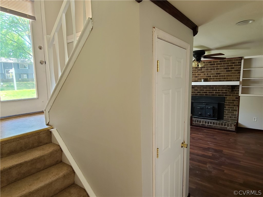 9326 Emmett Road Glen Allen, VA 23060 - Photo 19 of 29 a view of entryway with wooden floor and a fireplace