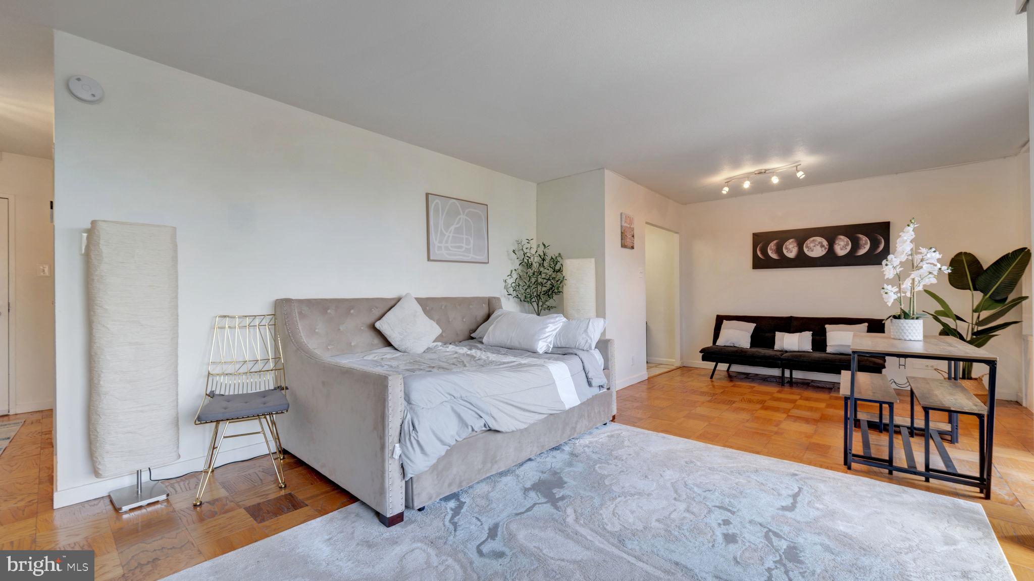 490 M Street Southwest, Unit W110 Washington, DC 20024 - Photo 3 of 11 a living room with furniture and a flat screen tv